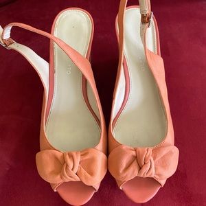 Orange sling back wedge shoe